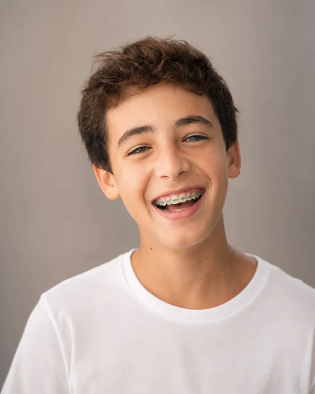 Teen boy smiling with metal braces