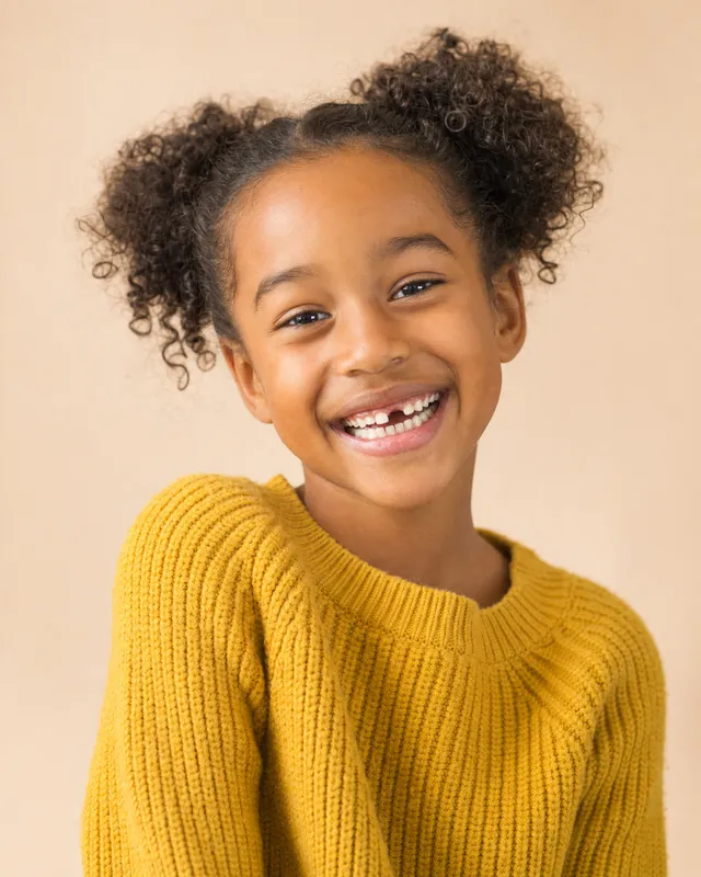 Smiling girl with a gap-toothed smile